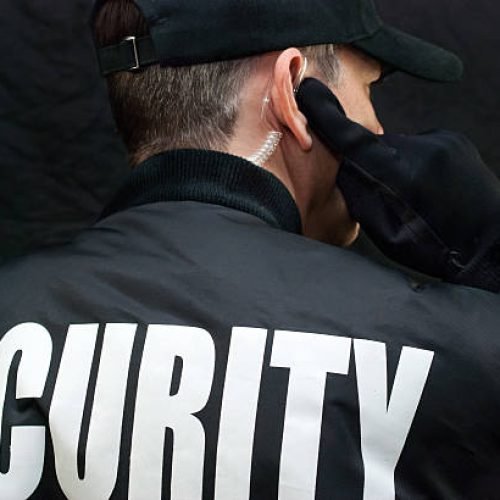 Event security officer coordinating guest safety